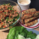 A perfect dinner, with Teigen’s caesar sriracha dipping sauce in the background.